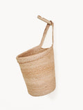 Woven basket with a handle on a white background