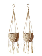 Two macrame plant hangers with woven designs and tassels on a white background.