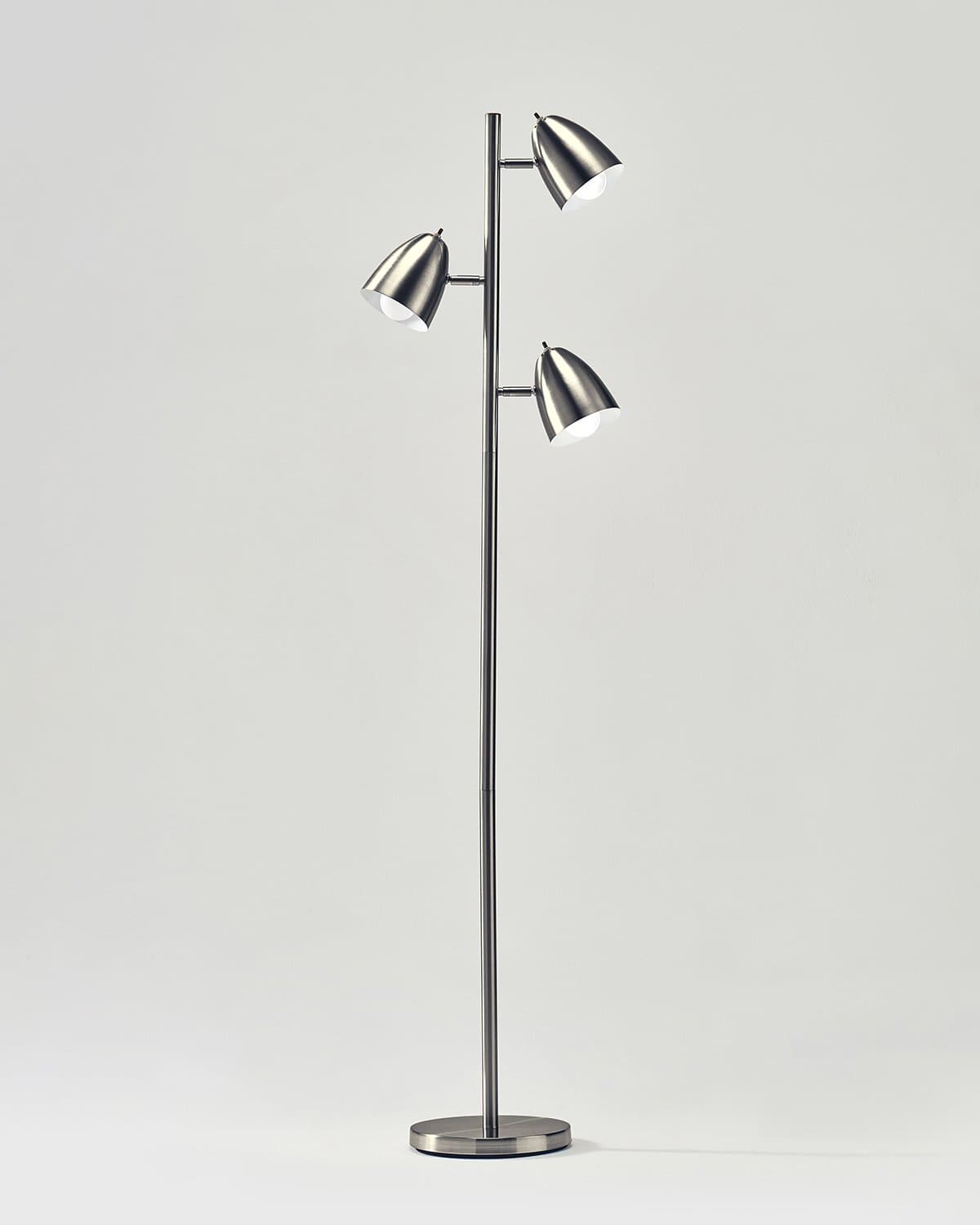 Modern floor lamp with three silver lampshades on a white background