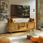 Wooden entertainment console with speakers on a white background