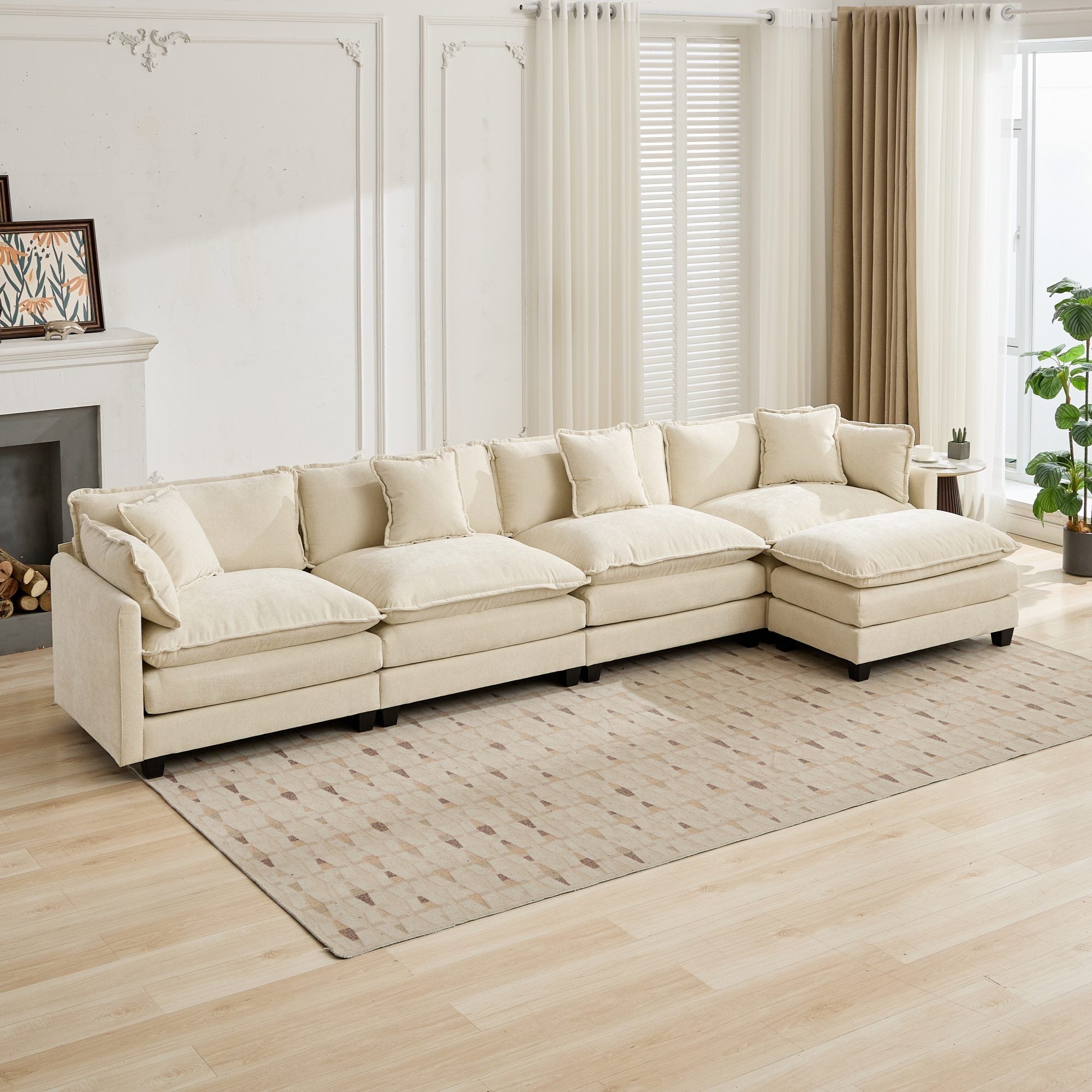 Beige sectional sofa in a living room with light wood flooring and white walls.