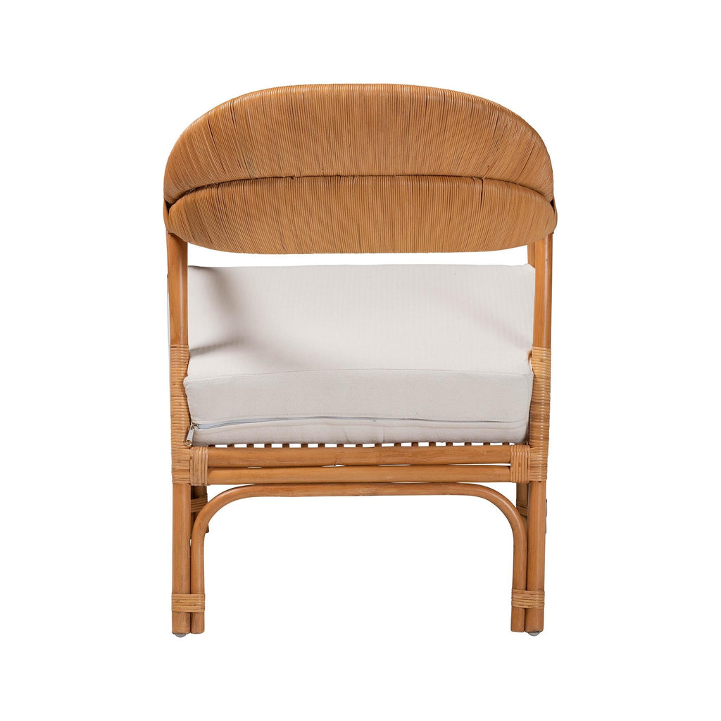Wicker chair with a white cushion on a white background