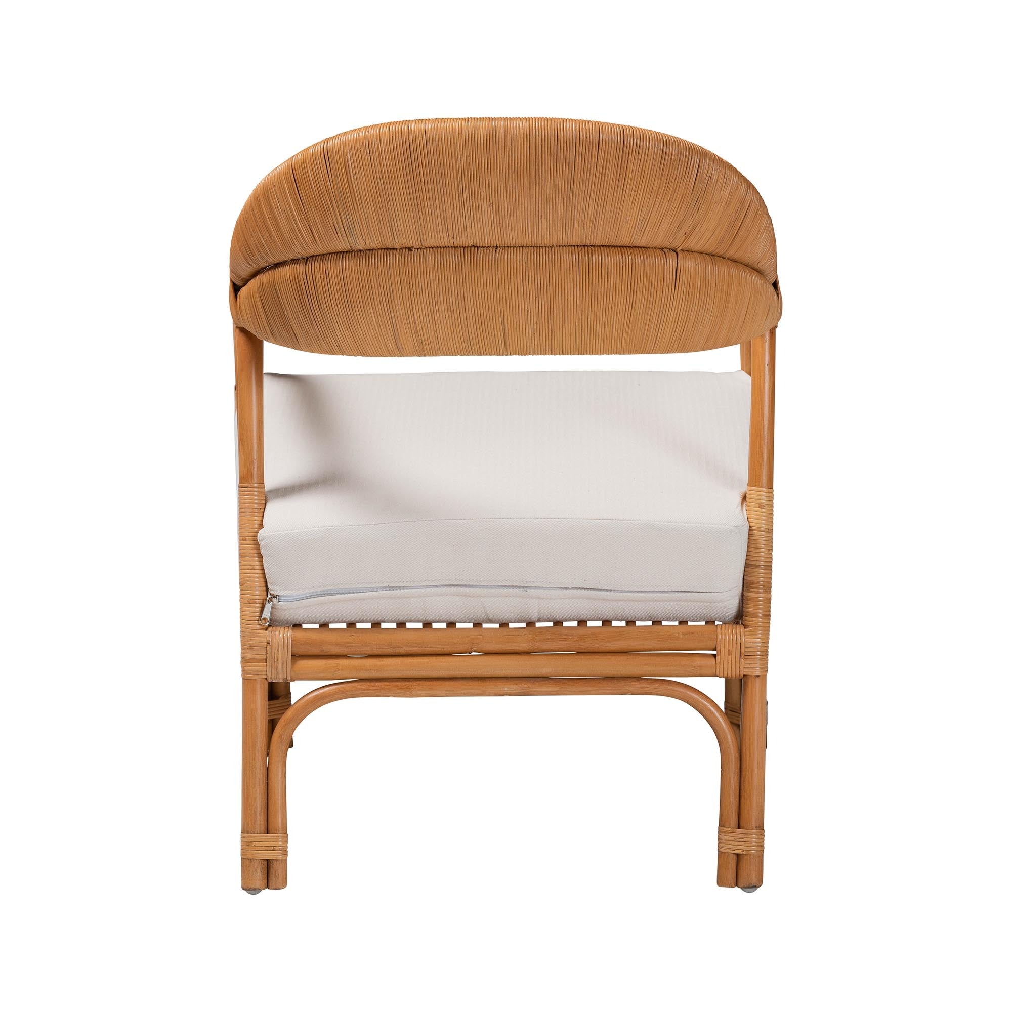Wicker chair with a white cushion on a white background