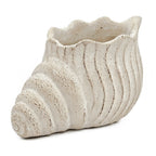 Ceramic vase with textured surface on a white background