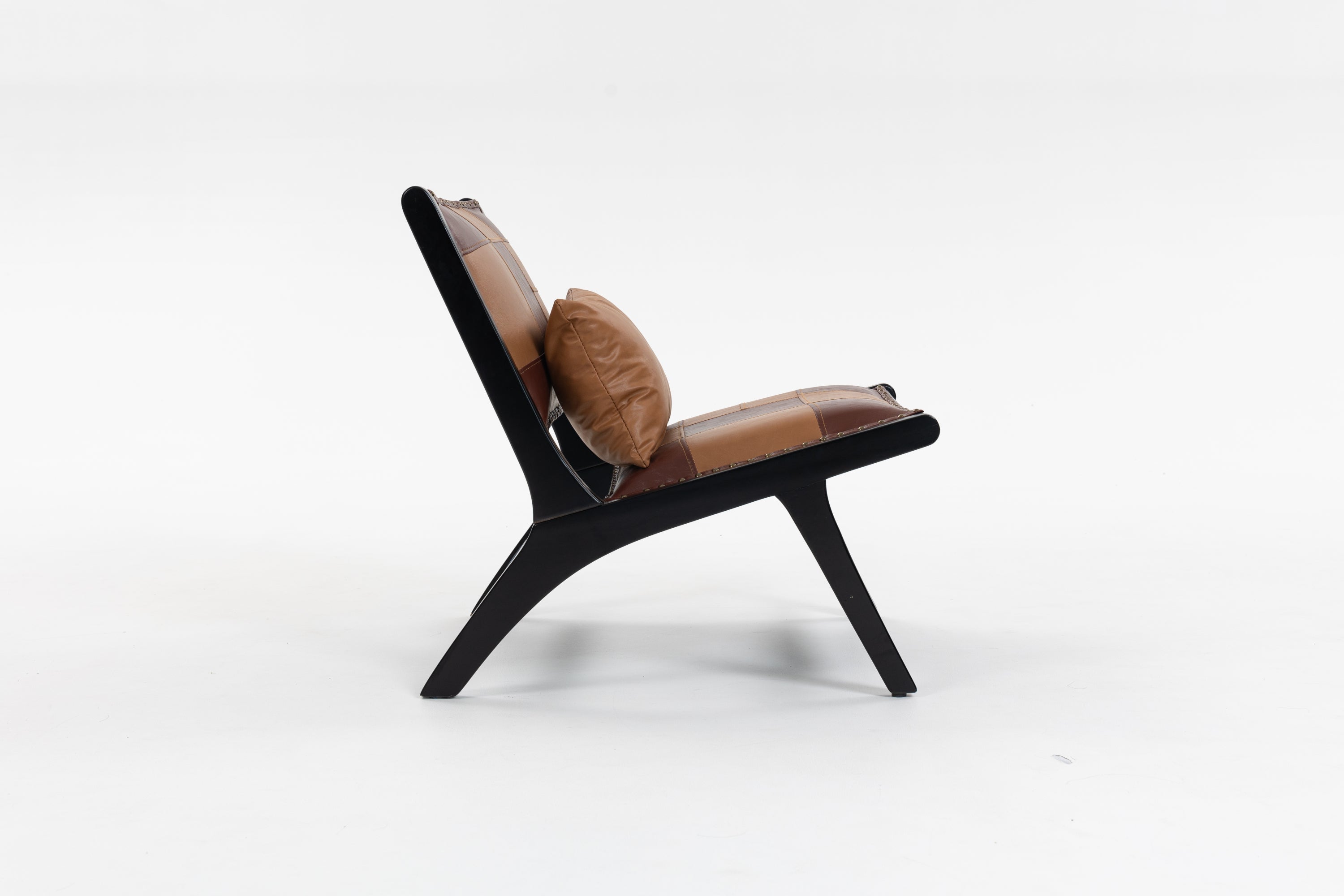 Brown leather chair with black frame on a white background