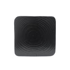 Black square tabletop with concentric circular pattern on a white background