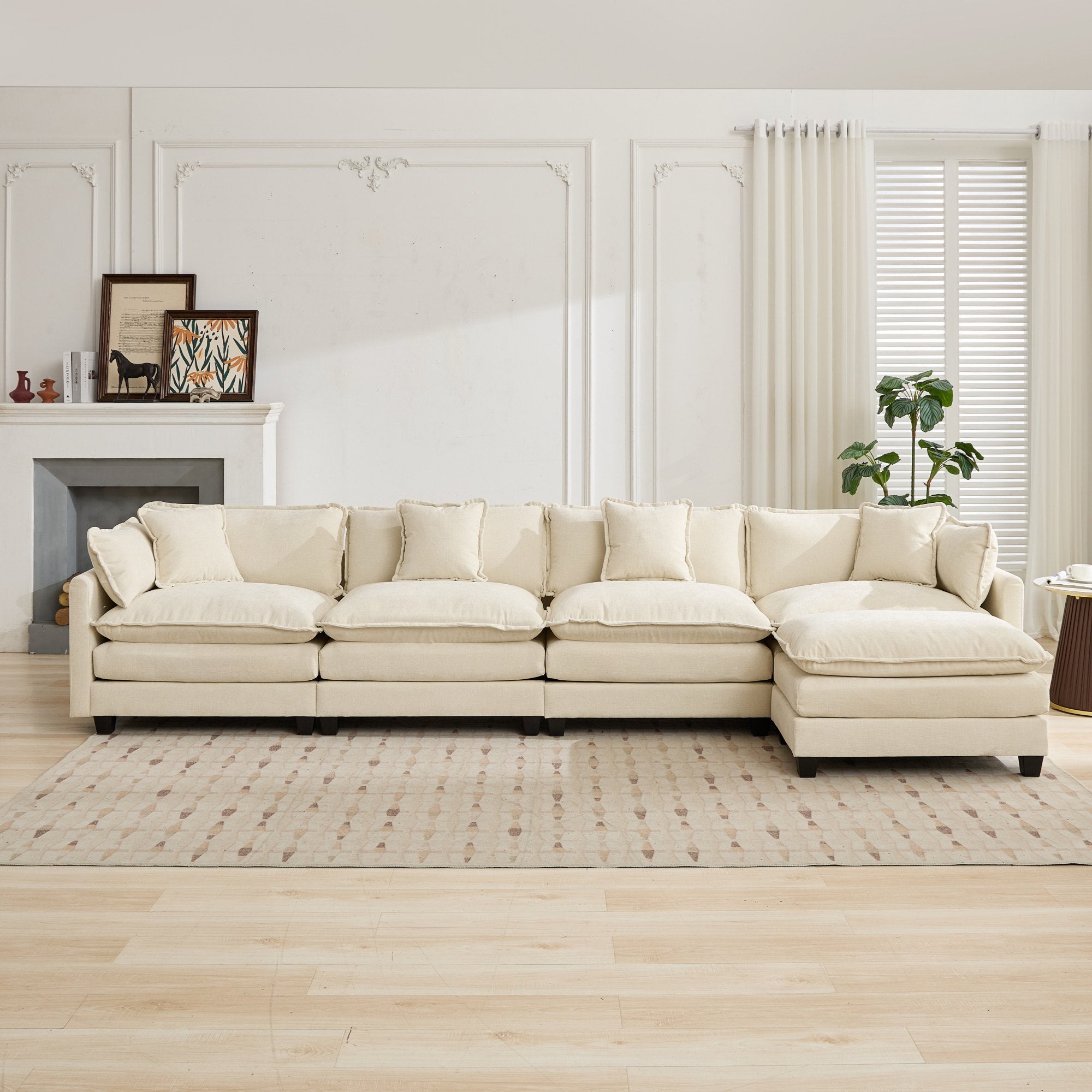 Beige sectional sofa in a living room with a fireplace and decor.