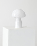 White mushroom-shaped lamp on a white background