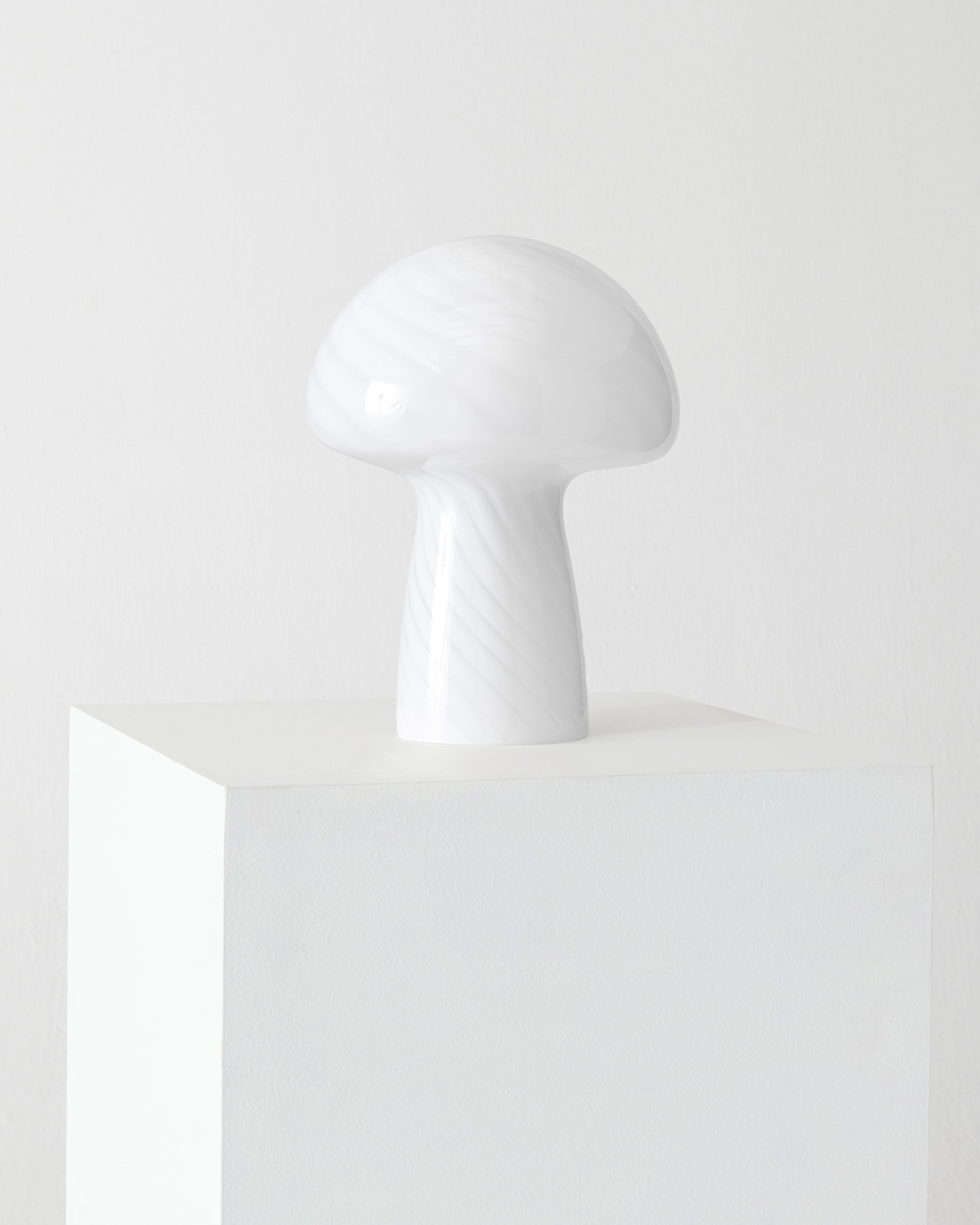 White mushroom-shaped lamp on a white background
