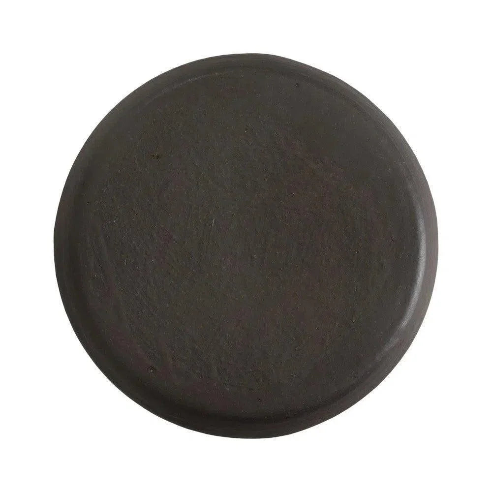 Round black object on a white background
