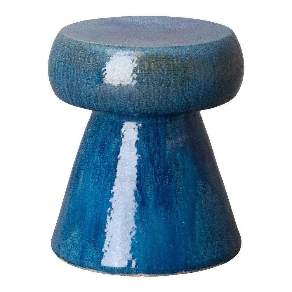 Blue ceramic stool with a textured surface on a white background