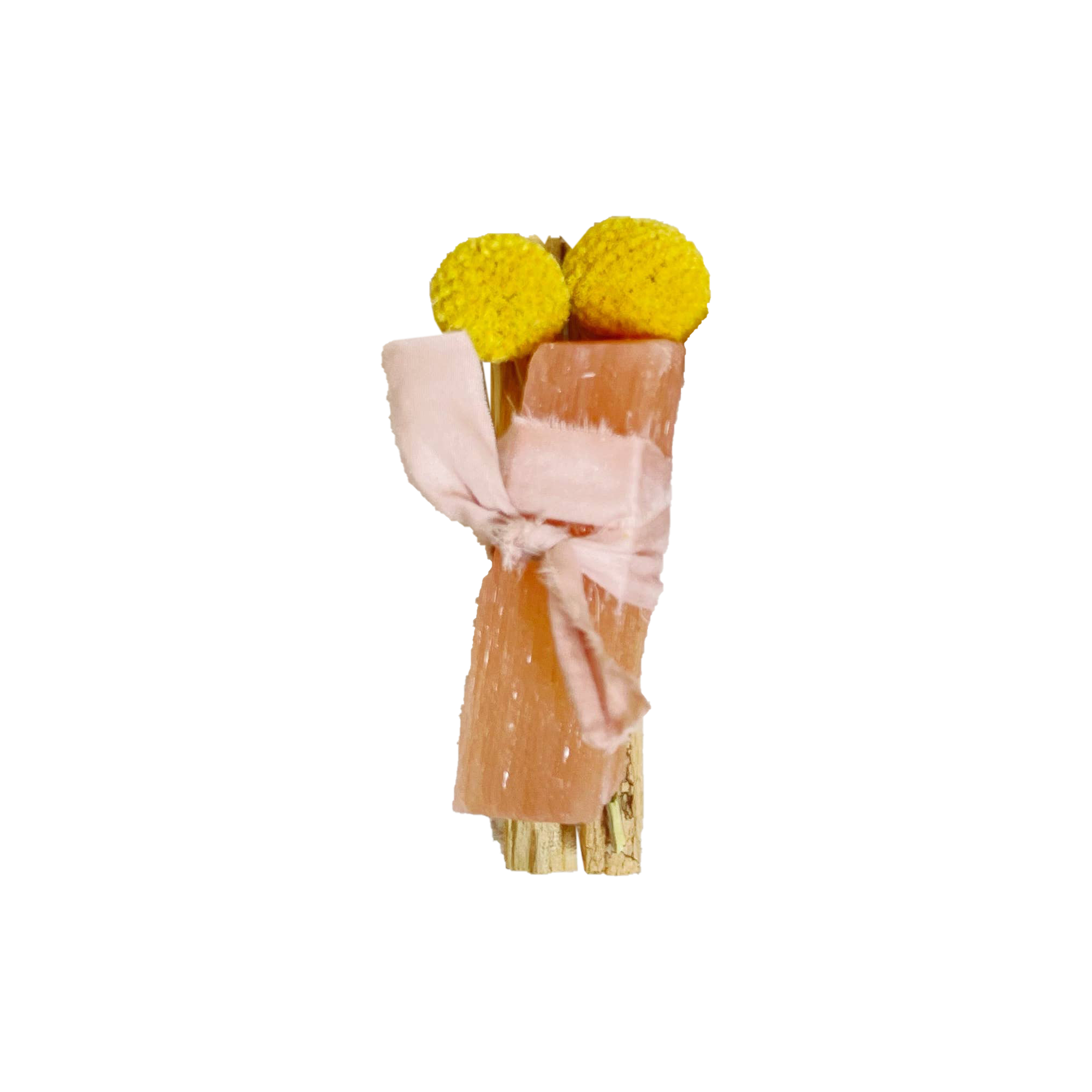 Two yellow pom-poms tied with a pink ribbon on a white background