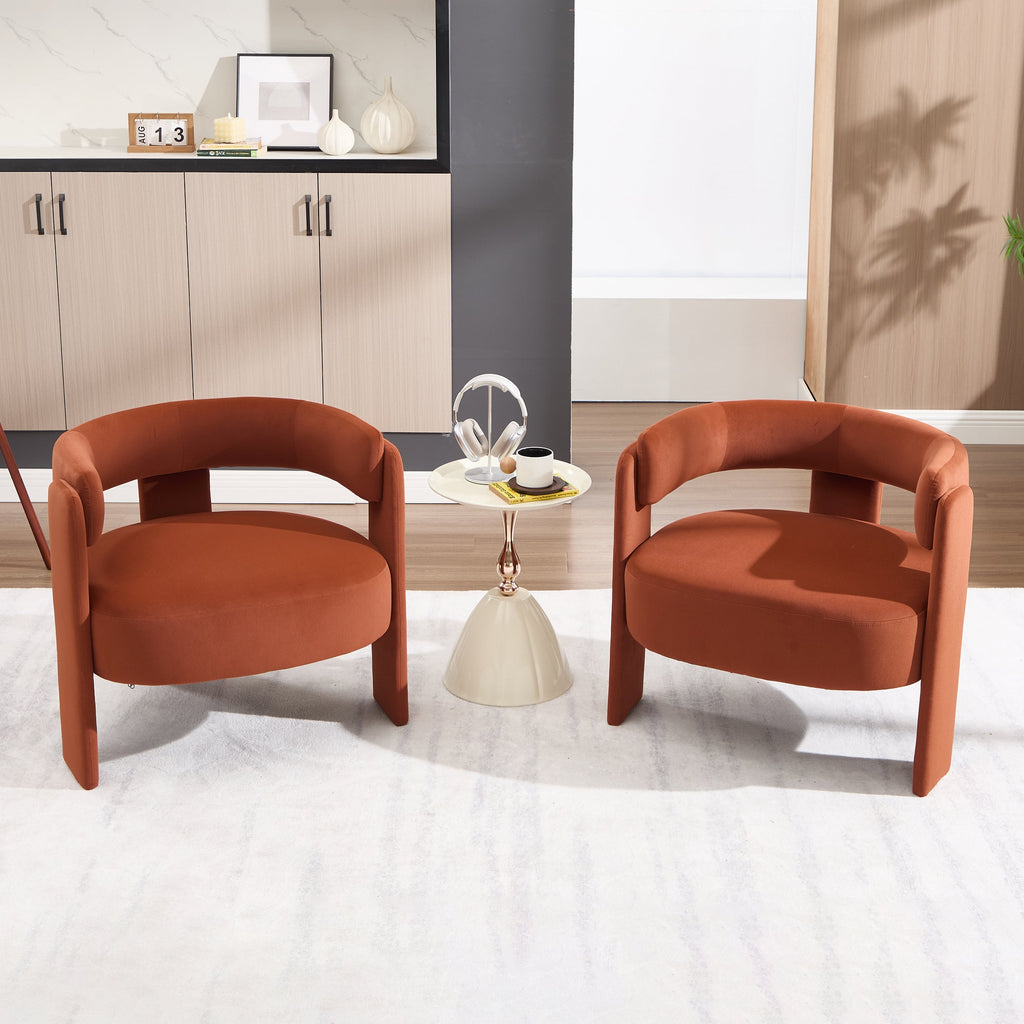 Two brown armchairs in a modern room with a small table and decor items.
