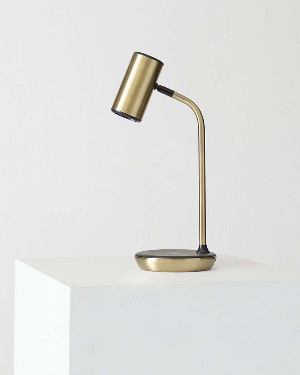 Gold desk lamp on a white background
