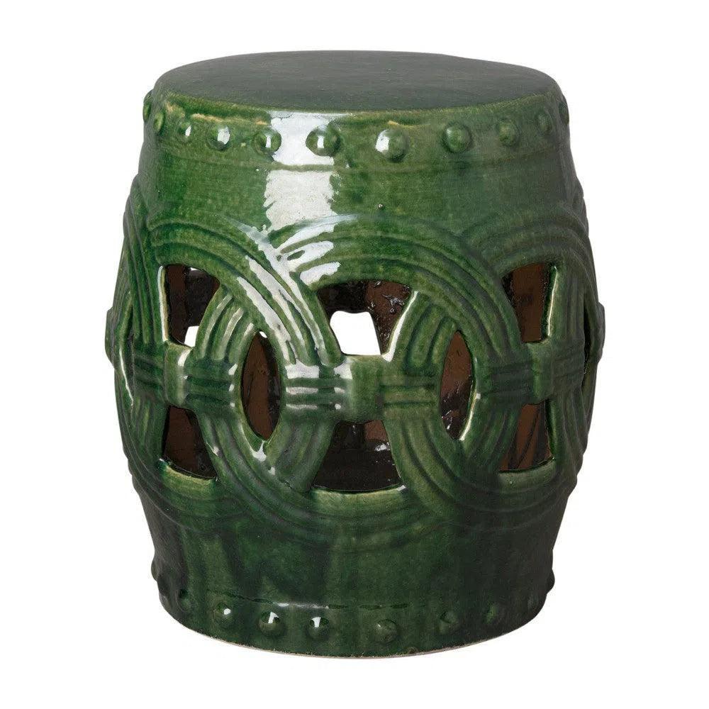 Green ceramic stool with decorative patterns on a white background
