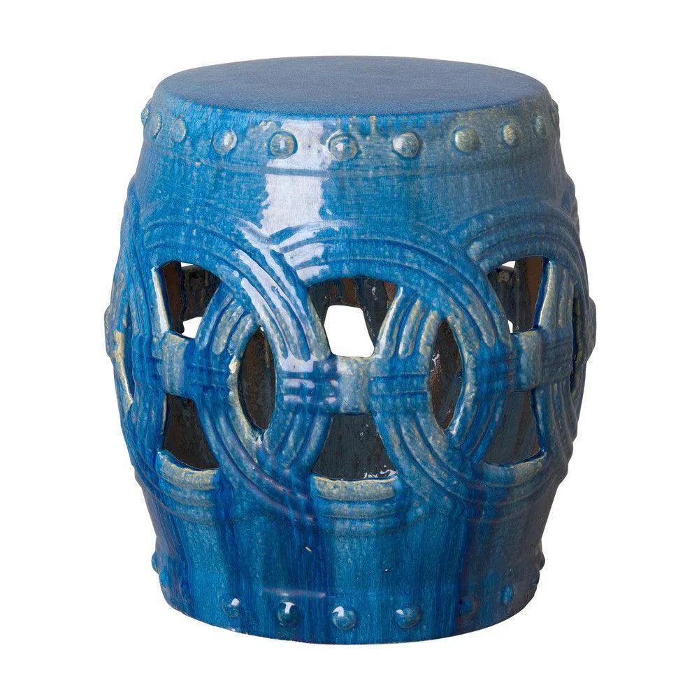 Blue decorative stool with intricate design on a white background