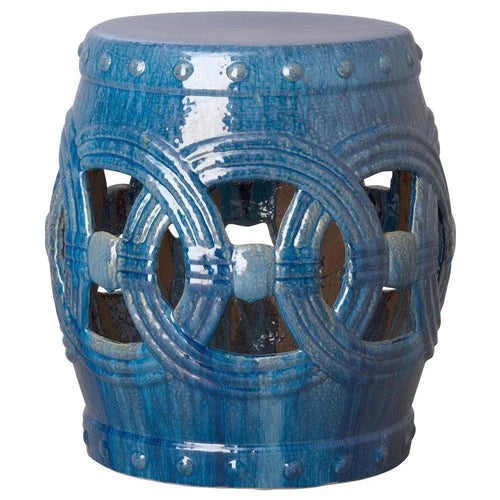 Blue ceramic stool with decorative patterns on a white background
