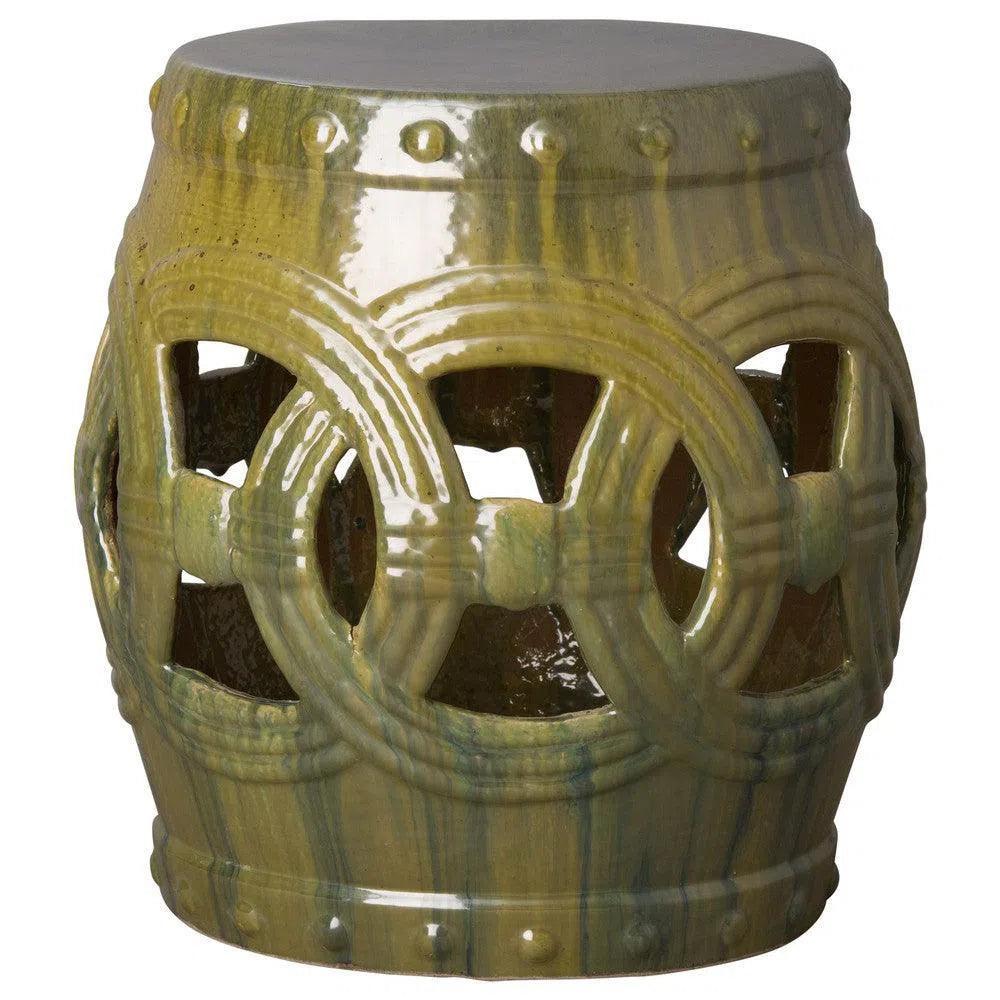 Decorative ceramic stool with green glaze on a white background