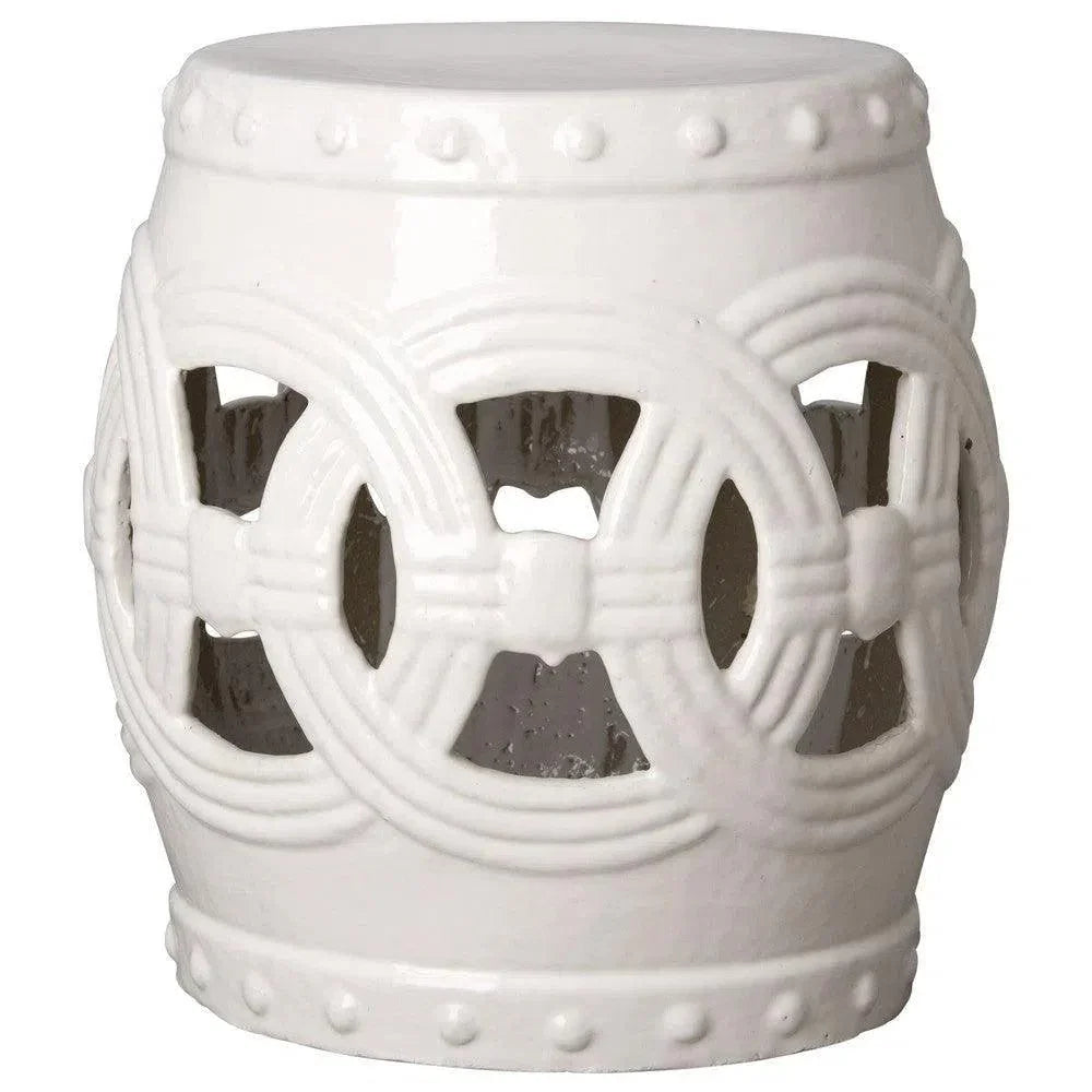 White decorative stool with intricate patterns on a white background