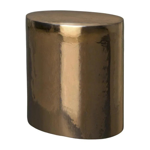Bronze-colored cylindrical stool on a white background