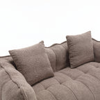 Brown textured sofa with cushions on a white background