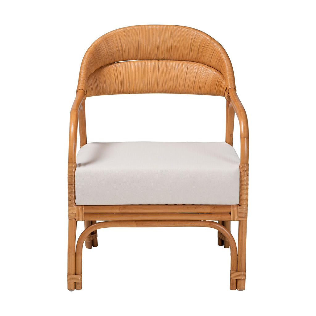 Wicker chair with white cushion on a white background