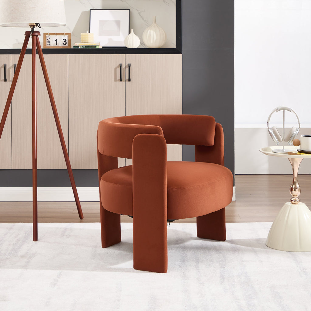 Orange armchair in a modern living room setting with decor elements.