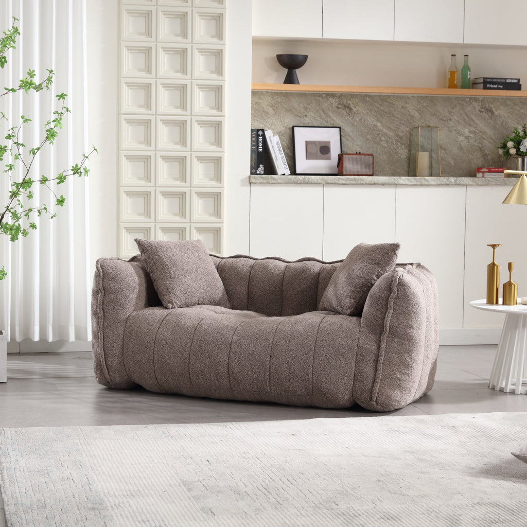 Gray sofa in a modern living room with decorative elements.