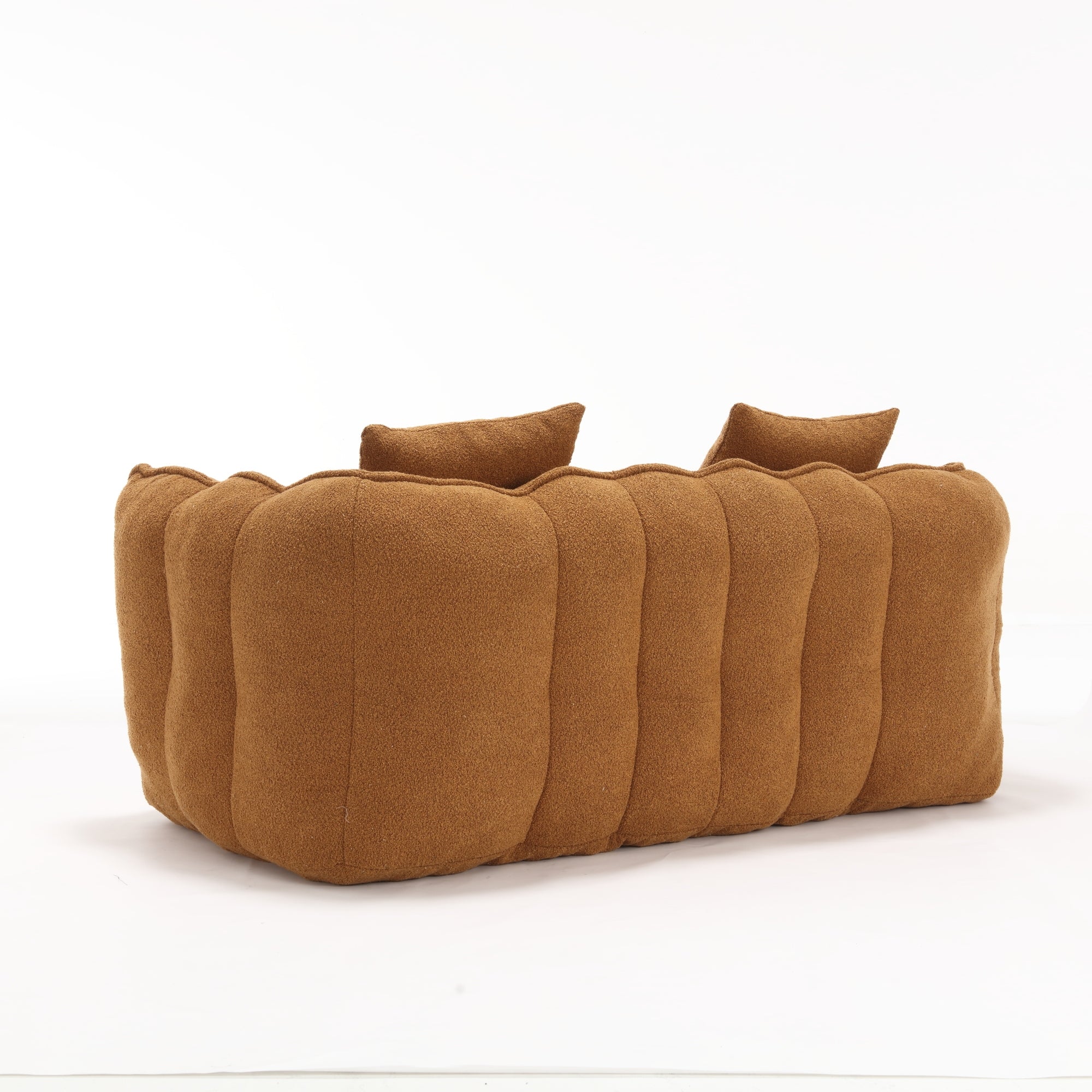 Brown sofa with three cushions on a white background