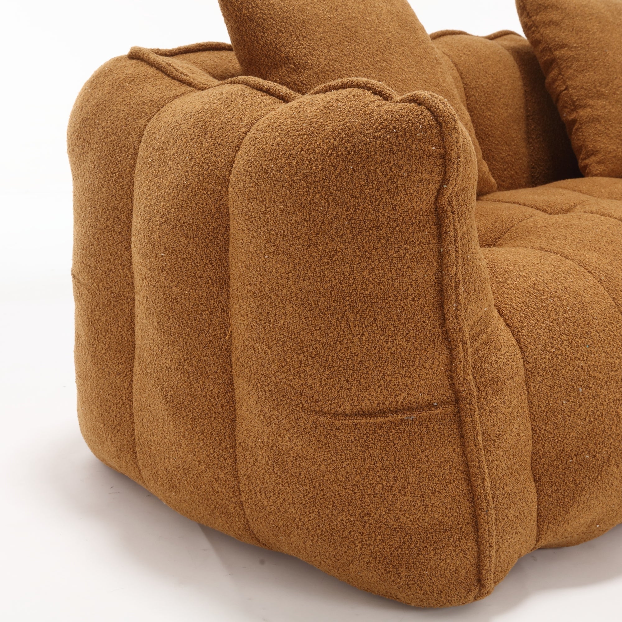 Close-up of a brown textured armchair on a white background