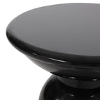 Black round side table on a white background