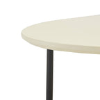 Round table with a light-colored top and black legs on a white background