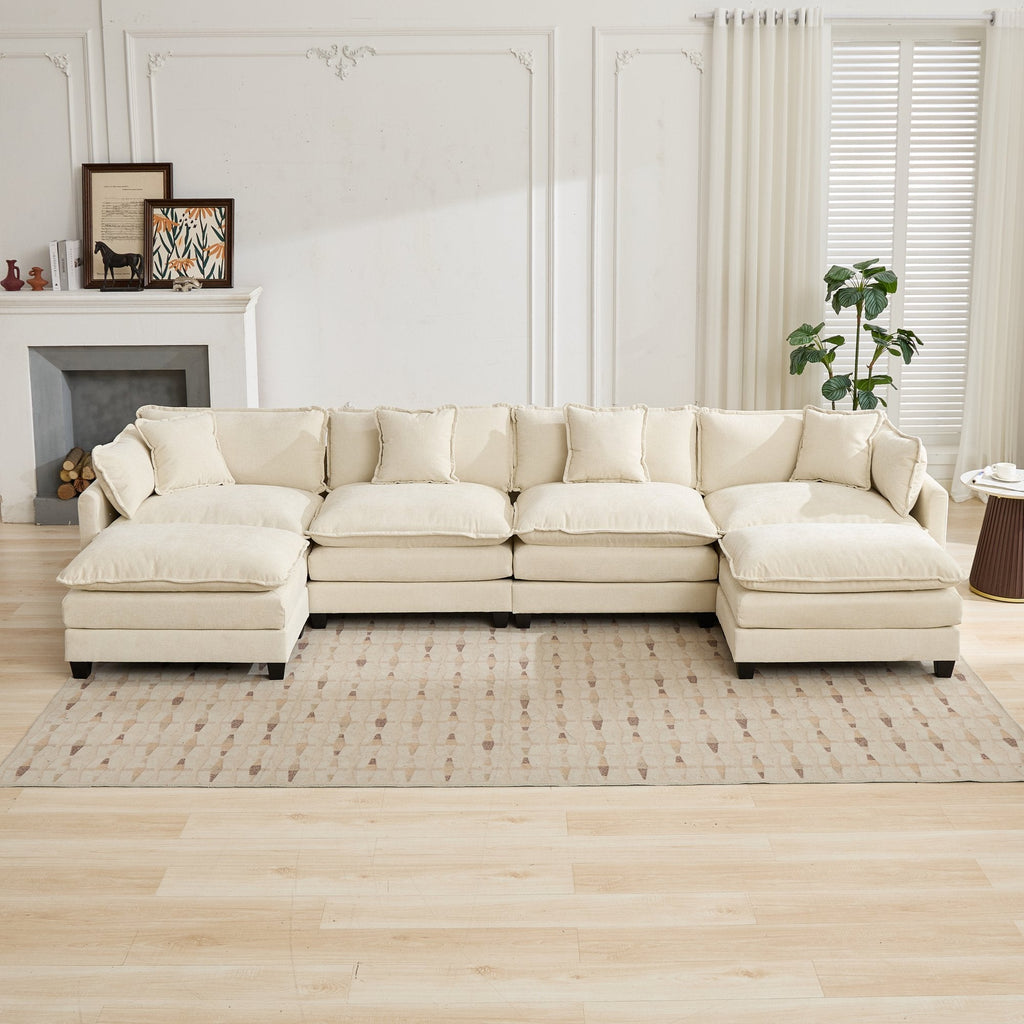 Beige sectional sofa in a living room with a fireplace and decor.