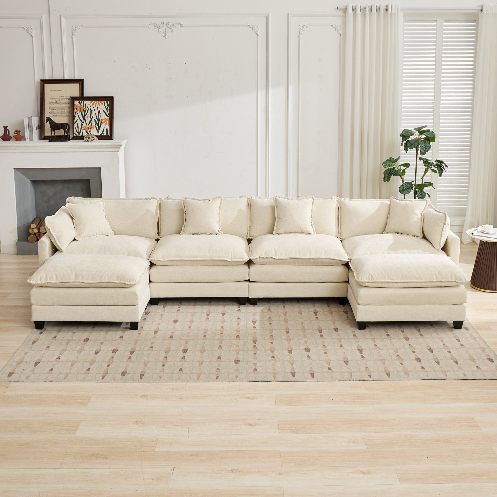 Beige sectional sofa in a living room with a fireplace and decor.