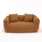 Brown sofa with two cushions on a white background
