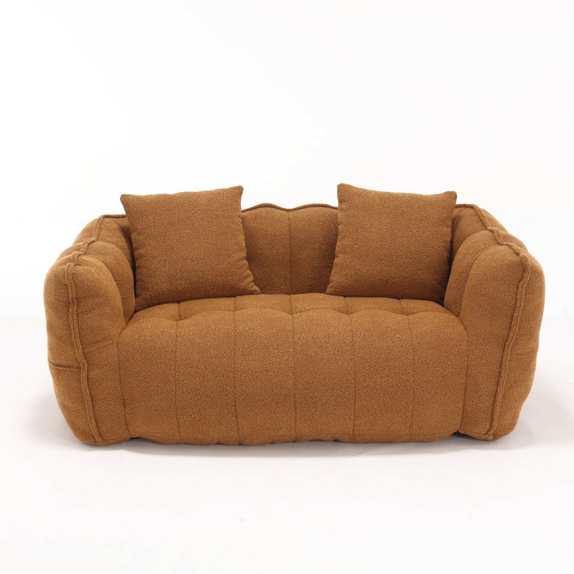 Brown sofa with two cushions on a white background