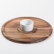 Wooden tray with a white bowl on a light background