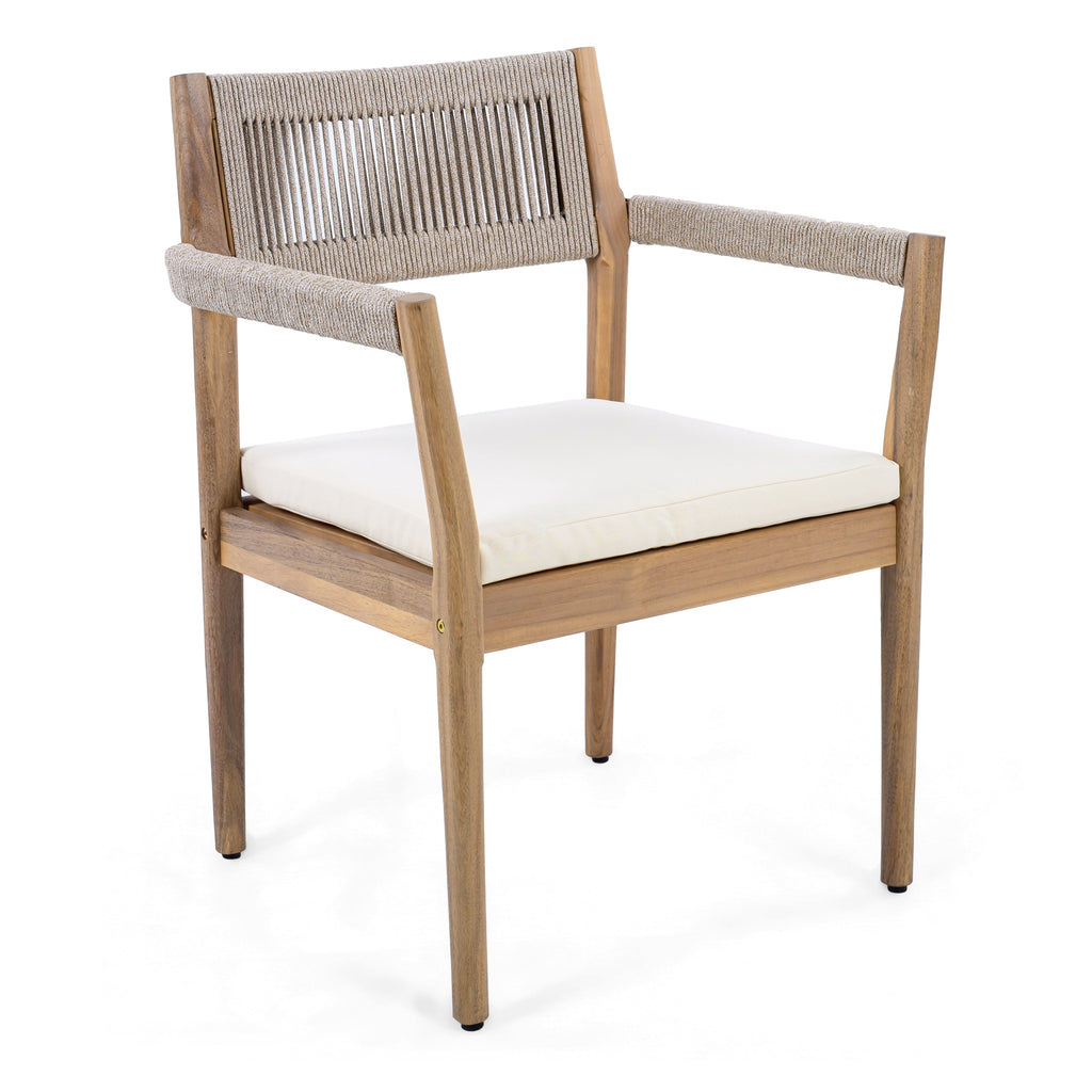 Wooden chair with woven backrest and white cushion on a white background