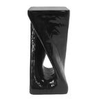 Black, glossy, abstract side table on a white background