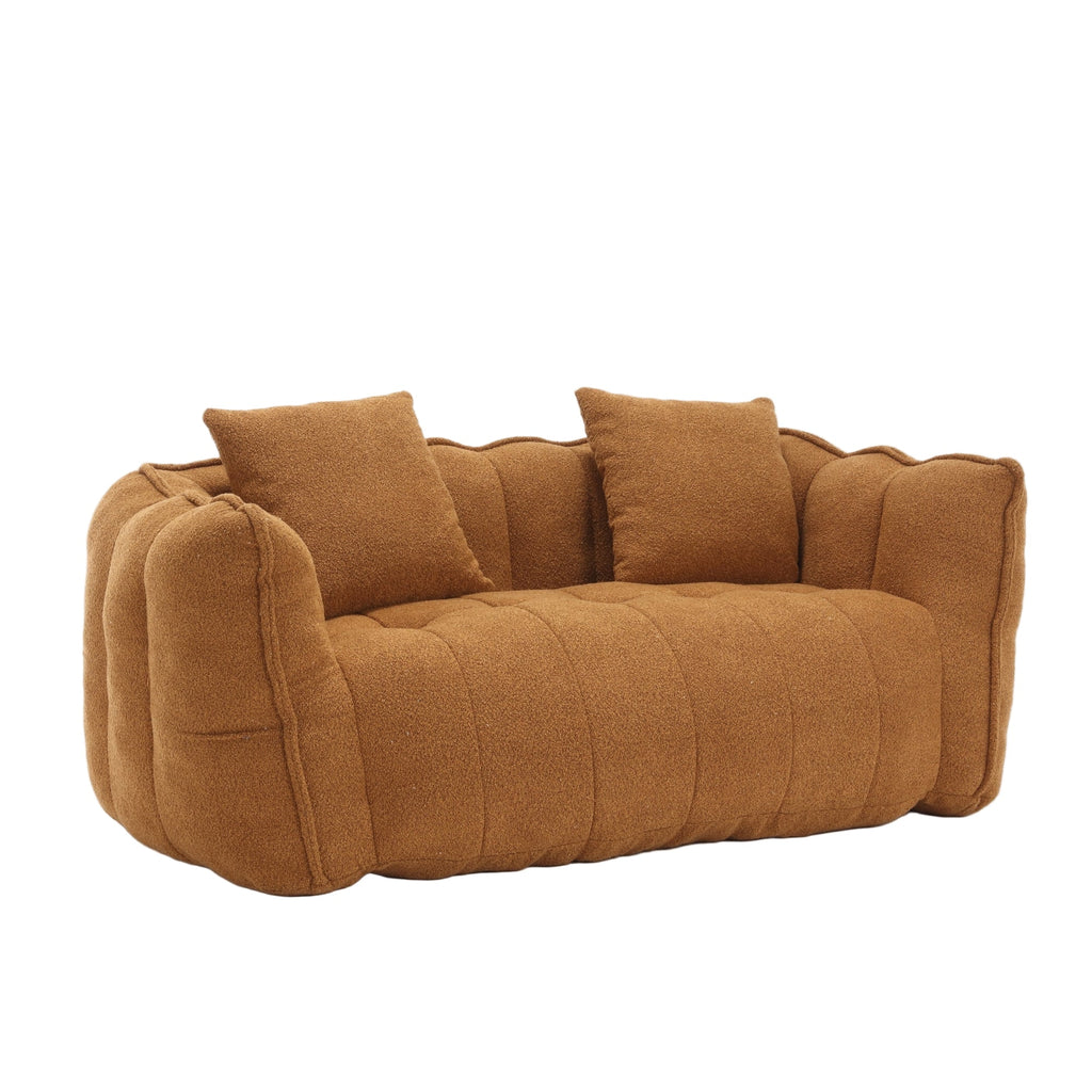 Brown sofa with two cushions on a white background