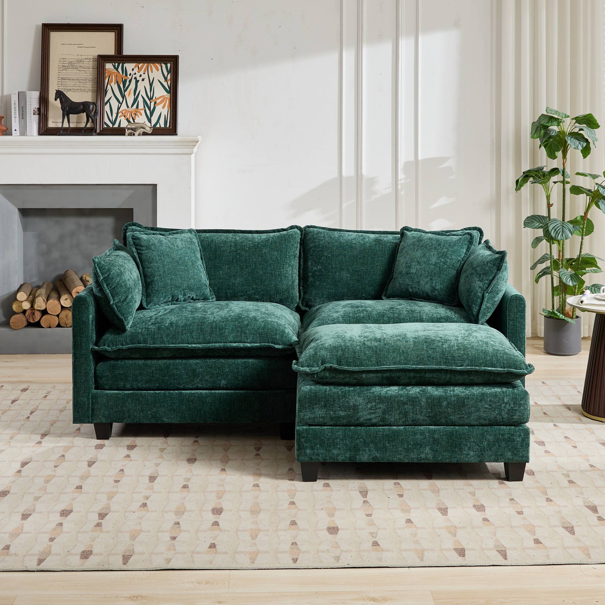 Green sectional sofa in a living room setting with a fireplace and decor.