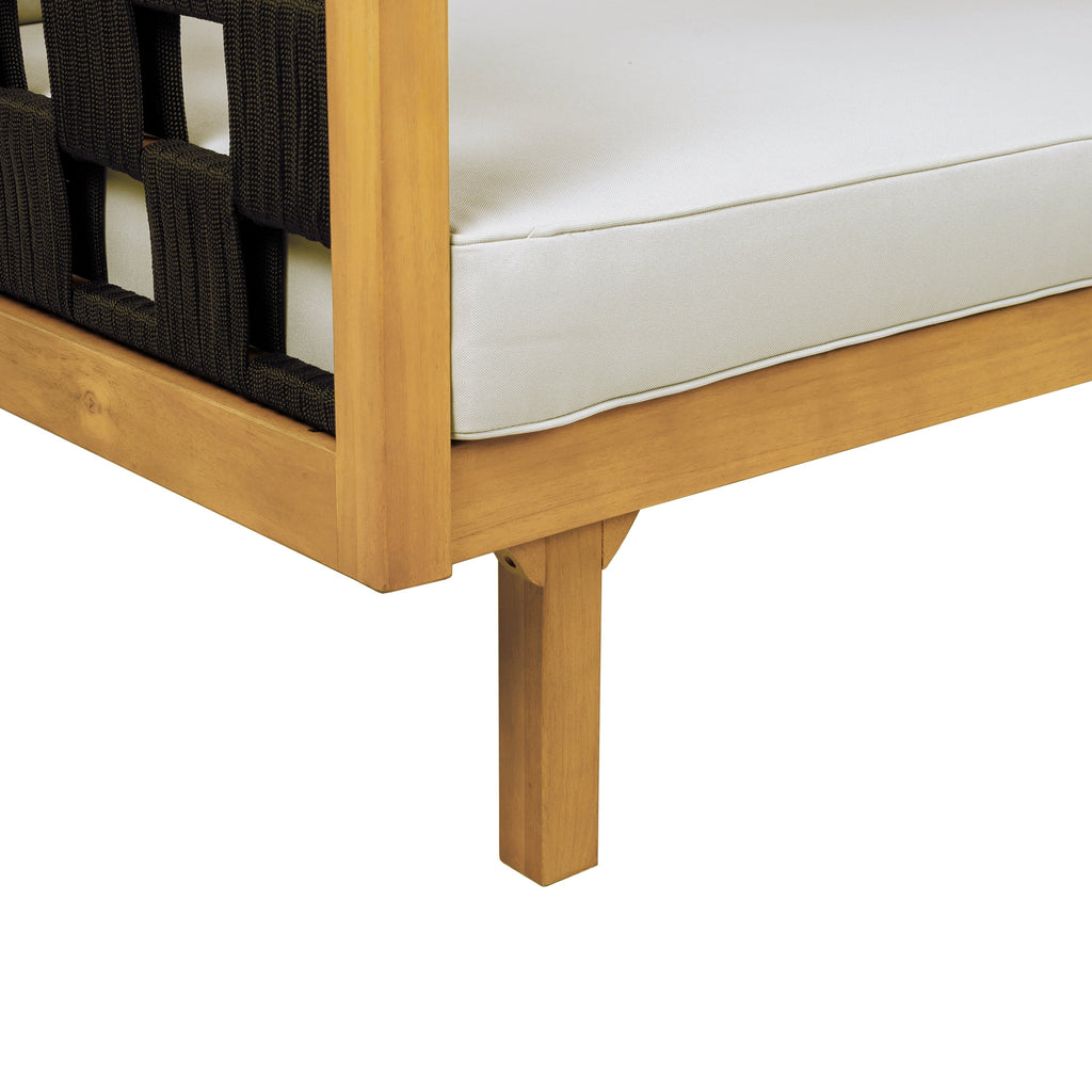 Close-up of a wooden chair with white cushion and black woven backrest on a white background
