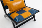 Chair with orange and blue checkered cushions on a white background