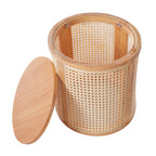 Wooden side table with wicker interior on a white background