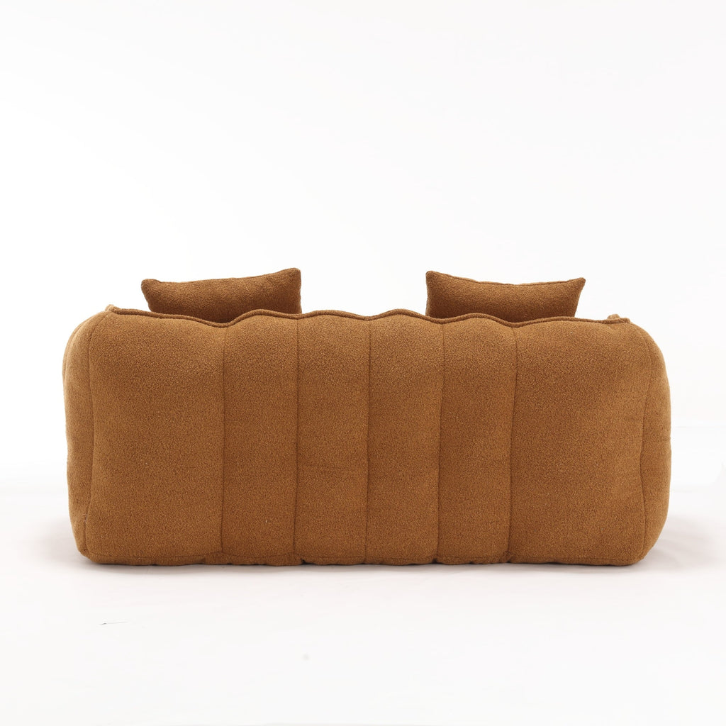 Brown cushioned sofa back on a white background