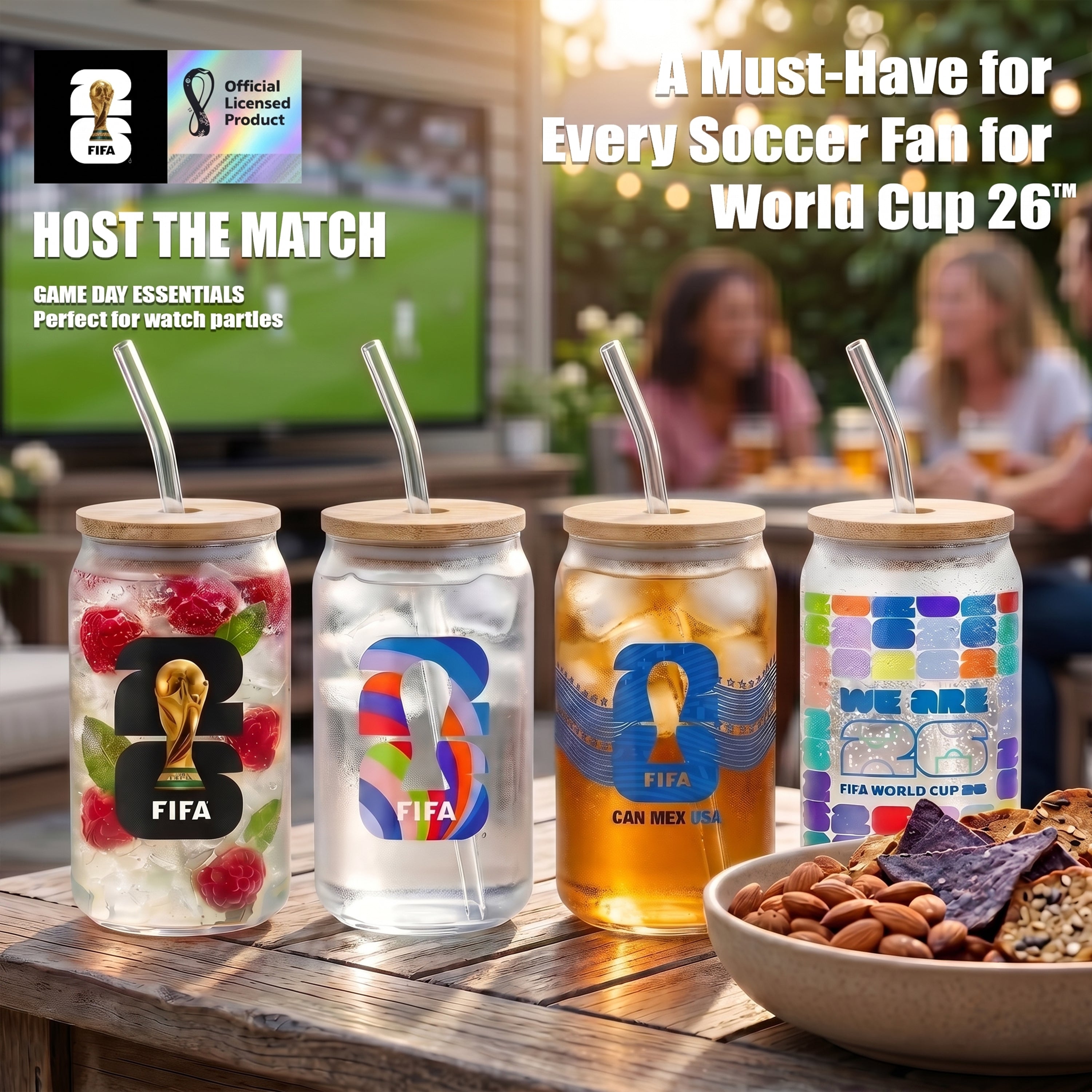 FIFA-themed mason jars with straws on a table with snacks, set against a blurred background of people watching a soccer match.