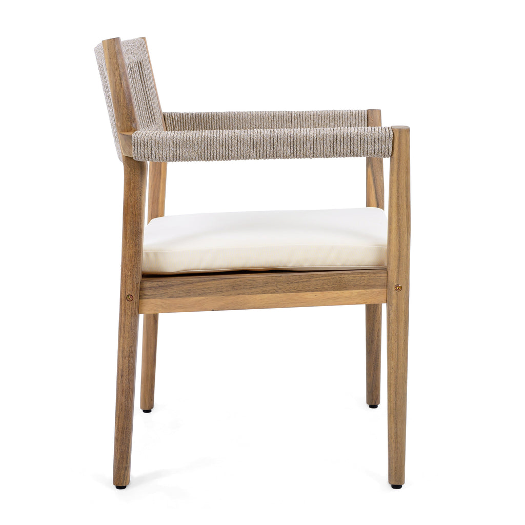 Wooden chair with woven backrest and white cushion on a white background