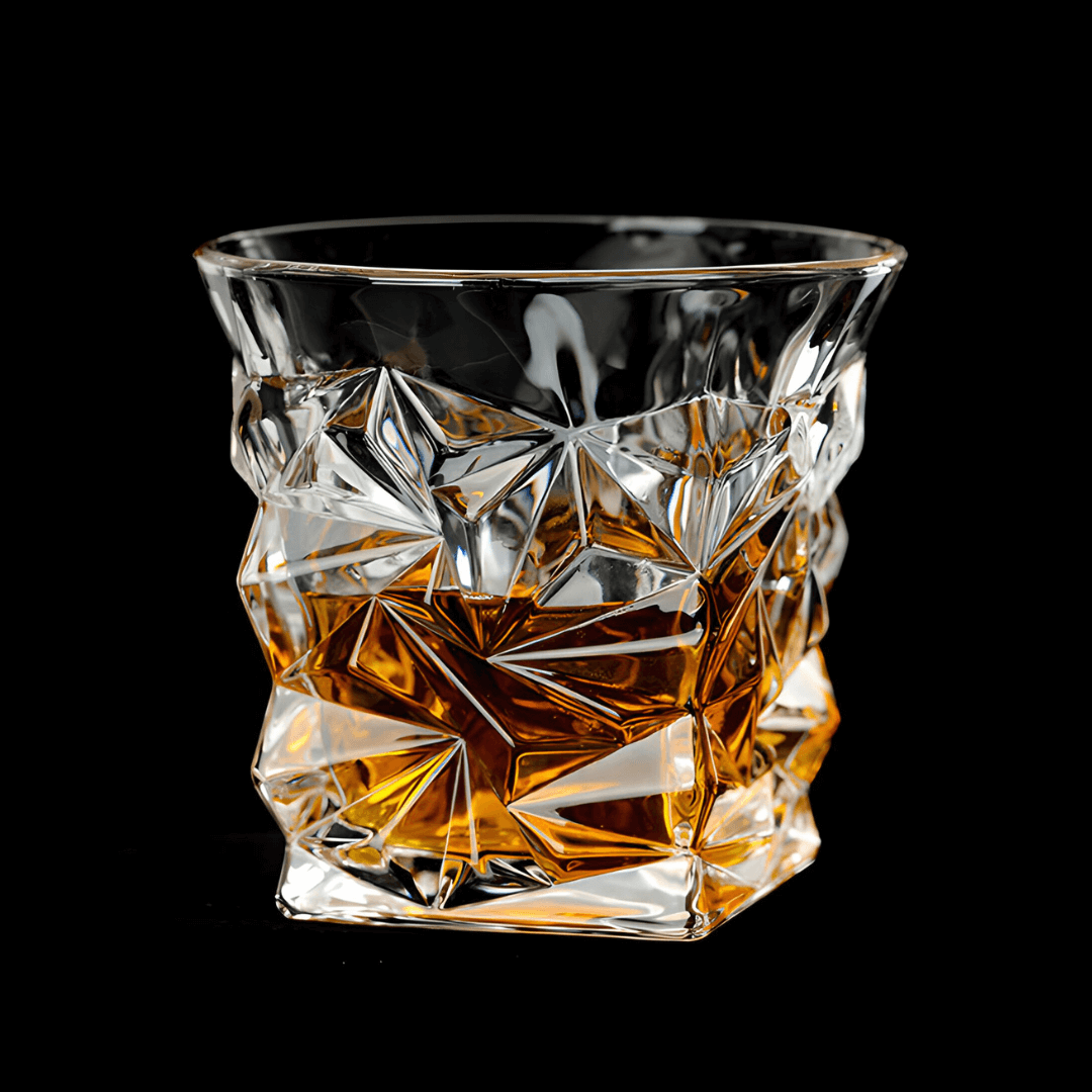 Crystal glass filled with amber liquid on a black background