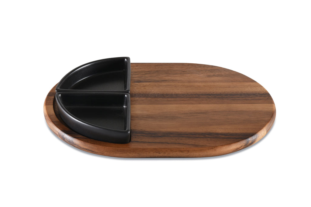 Wooden cutting board with black divided plate on a white background