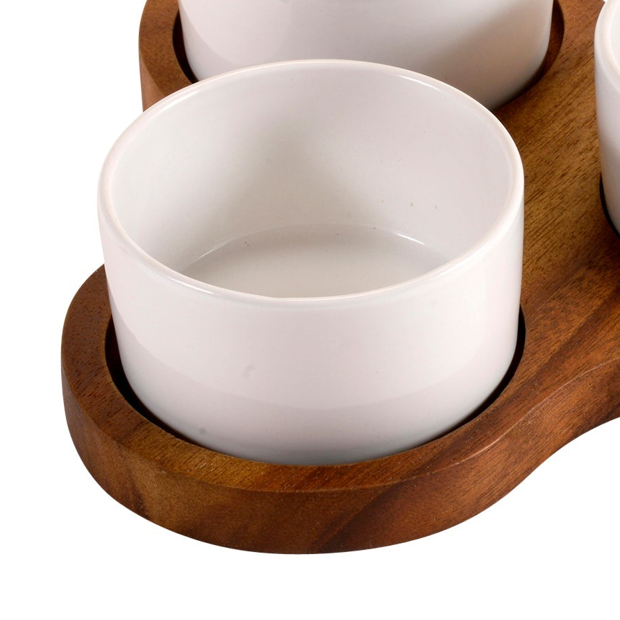 White ceramic bowl on a wooden tray